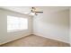 Bedroom with neutral walls, carpet, fan and a window offering great light at 204 Candleberry Cir, Goose Creek, SC 29445