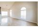 Bright living room boasting beautiful hardwood floors, high ceilings, and large arched windows at 204 Candleberry Cir, Goose Creek, SC 29445