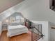 Charming bedroom featuring hardwood floors and natural light from windows and a decorative railing at 204 Live Oak Dr, Mount Pleasant, SC 29464