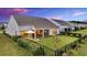 Fenced backyard with green lawn, patio, and a relaxing screened-in porch at 205 Potters Pass Dr, Summerville, SC 29486
