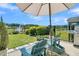 Relaxing backyard patio with inviting seating, a barbecue grill, and a peaceful lake view at 205 Potters Pass Dr, Summerville, SC 29486