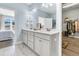 Bathroom featuring a double vanity, white cabinets, and a walk-in closet at 205 Potters Pass Dr, Summerville, SC 29486