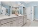 Bright bathroom features a double vanity with white countertops and cabinetry, plus updated fixtures at 205 Potters Pass Dr, Summerville, SC 29486