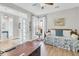 Bright bedroom with a daybed, large windows, and a ceiling fan at 205 Potters Pass Dr, Summerville, SC 29486