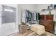 Walk-in closet with built-in shelving and wooden dresser offers lots of room for storing belongings at 205 Potters Pass Dr, Summerville, SC 29486