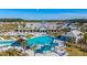 Aerial view of the community pool with a full lounge area, covered cabanas, and plenty of outdoor seating at 205 Potters Pass Dr, Summerville, SC 29486