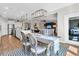 An open living space with a dining room, kitchen, and living room, providing ample space for entertaining at 205 Potters Pass Dr, Summerville, SC 29486