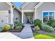 Charming home featuring manicured landscaping, a covered porch, and neutral siding at 205 Potters Pass Dr, Summerville, SC 29486