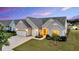 Attractive single-story home with a well-maintained lawn, a two-car garage and lovely landscaping at 205 Potters Pass Dr, Summerville, SC 29486