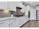 A modern kitchen with white cabinets, a gas range, and stainless steel appliances at 205 Potters Pass Dr, Summerville, SC 29486