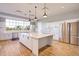 Modern kitchen features stainless appliances, tile backsplash, and a spacious center island at 205 Potters Pass Dr, Summerville, SC 29486