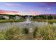 Beautiful fountain view from this home, located on a pond with lush landscaping and mature trees at 205 Potters Pass Dr, Summerville, SC 29486