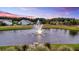 Pond featuring a fountain, surrounded by lawns and trees at 205 Potters Pass Dr, Summerville, SC 29486