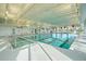 Indoor pool area with natural lighting and marked lanes for swimming at 205 Potters Pass Dr, Summerville, SC 29486