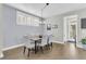 Formal dining area featuring a wooden table, six upholstered chairs, and elegant chandelier lighting at 207 Billinger St, Summerville, SC 29486