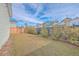 Spacious backyard featuring lush greenery, trees and a wooden fence, perfect for outdoor activities at 219 Clearblue Loop, Summerville, SC 29486