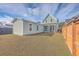 An expansive, well-maintained lawn and a charming view of the home's architectural details at 219 Clearblue Loop, Summerville, SC 29486