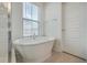 Close up of the free standing tub with large window for natural light at 219 Clearblue Loop, Summerville, SC 29486