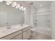 Bathroom with double vanity, framed mirror, and tub shower combo at 219 Clearblue Loop, Summerville, SC 29486