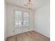 Versatile room featuring hardwood floors and French doors leading outside at 219 Clearblue Loop, Summerville, SC 29486