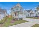 Charming home with a manicured lawn, attached garage, and inviting curb appeal at 219 Clearblue Loop, Summerville, SC 29486