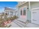 Eye-catching, close-up of the pink double front door with glass panes and house number 219 at 219 Clearblue Loop, Summerville, SC 29486
