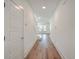 Bright hallway with hardwood floors, white walls, and staircase leading to the upper level at 219 Clearblue Loop, Summerville, SC 29486