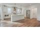 Bright kitchen featuring white cabinets, a center island, and stainless steel appliances at 219 Clearblue Loop, Summerville, SC 29486