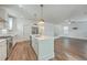 Bright kitchen overlooking the living area featuring stainless steel appliances and a large island at 219 Clearblue Loop, Summerville, SC 29486