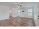 Open living area with hardwood floors, white walls, and adjacent staircase at 219 Clearblue Loop, Summerville, SC 29486