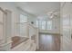 Well-lit living room with hardwood floors, white walls, and a staircase at 219 Clearblue Loop, Summerville, SC 29486