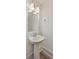Stylish pedestal sink with brushed nickel faucet and light fixture at 219 Clearblue Loop, Summerville, SC 29486