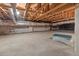 Large unfinished basement with exposed ceiling beams and concrete foundation at 23 Elliott St, Charleston, SC 29401