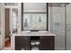 Bathroom featuring a double vanity, large mirror, and glass-enclosed shower at 23 Elliott St, Charleston, SC 29401