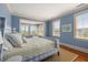 Bedroom featuring a plaid bedspread and several large windows at 23 Elliott St, Charleston, SC 29401