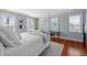 Bright bedroom with natural light, hardwood floors, and a decorative rug at 23 Elliott St, Charleston, SC 29401