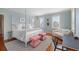 Bright bedroom features a seating area, decorative rug, and a four poster bed at 23 Elliott St, Charleston, SC 29401
