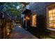 Stunning brick house with illuminated landscaping and inviting entrance at 23 Elliott St, Charleston, SC 29401