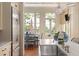 Well-lit kitchen featuring stainless steel appliances and an adjacent breakfast nook at 23 Elliott St, Charleston, SC 29401