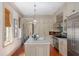 Spacious kitchen featuring a large island, stainless appliances, and ample cabinet storage at 23 Elliott St, Charleston, SC 29401