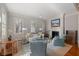 Bright and airy living room with hardwood floors, elegant furniture, and a cozy fireplace at 23 Elliott St, Charleston, SC 29401