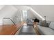 Bright living area with high ceilings, hardwood floors, modern furnishings, and access to an outdoor dining space at 23 Elliott St, Charleston, SC 29401