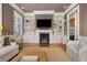 Living Room features a fireplace, built-in shelves, and seating area at 23 Elliott St, Charleston, SC 29401