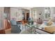 Spacious living room with hardwood floors, comfortable seating, and a view into a bright foyer at 23 Elliott St, Charleston, SC 29401