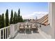 Balcony with seating and table offers a charming space to relax with cityscape and lush greenery views at 23 Elliott St, Charleston, SC 29401