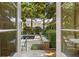 Backyard pool and patio area, as seen through glass doors at 23 Elliott St, Charleston, SC 29401