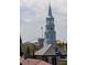 City rooftop view of a church steeple and historic buildings at 23 Elliott St, Charleston, SC 29401