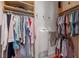 Organized walk-in closet with clothing racks and storage shelving at 23 Elliott St, Charleston, SC 29401