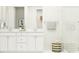 Elegant bathroom with a double vanity, modern fixtures, a glass-enclosed shower, and stylish decor accents at 233 Denham St, Summerville, SC 29486