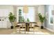 Elegant dining room with a large window, stylish light fixture, and seating for six, perfect for Gathering dinners at 233 Denham St, Summerville, SC 29486